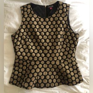 Vince Camuto sleeveless peplum zips in the back. Black and gold big polka dots.